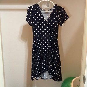 a polk-a-dot dress with a side tie
